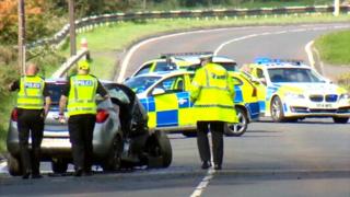 Police reviewing the crash scene