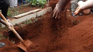 A file picture shows a body being buried in Kenya's capital Nairobi on 22 September, 2013