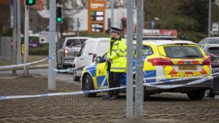 A police officer at the road closure at Rayleigh Weir