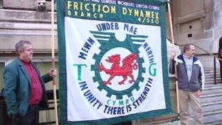 TGWU members holding a Friction Dynamex branch banner