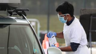 A man at a drive in test facility