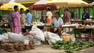 Market traders selling vegetables in Port Moresby, capital of Papua New Guinea