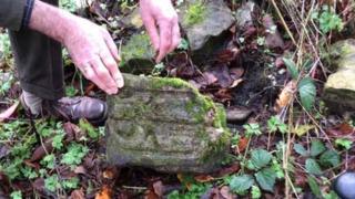 Verger Christopher Marshall found one of the cross fragments in St James' Church rectory garden