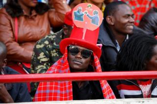 A man waits ahead of the inauguration ceremony for Uhuru Kenyatta at Kasarani Stadium in Nairobi, Kenya, 28 November