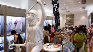 Two-meter-tall "Lady Liberty", a symbolic statue placed by pro-democracy protesters, stands in a Chickeeduck branch in Hong Kong,