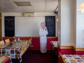 Customers at Flo's Cafe can get a photo taken with a cut out of the Queen. Blyth, Nottinghamshire.