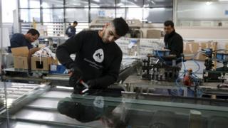 Palestinian labourers work at Aluminum Construction, a factory located at the West Bank settlement of Maale Adumim (22 February 2016)