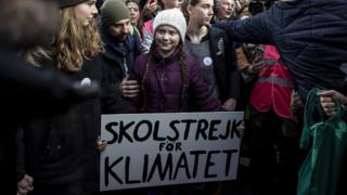 Greta Thunberg protesting