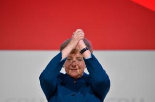German Chancellor and leader of the Christian Democratic Union (CDU) Angela Merkel acknowledges the applause after delivering her speech at a party congress of Germany"s conservative Christian Democratic Union (CDU) party on December 7, 2018 at a fair hall in Hamburg, northern Germany. - German Chancellor Angela Merkel will hand off leadership of her party after nearly two decades at the helm, with the race wide open between a loyal deputy and a longtime rival. (Photo by John MACDOUGALL / AFP)JOHN MACDOUGALL/AFP/Getty Images