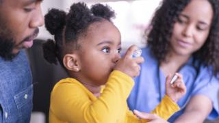 Girl using an inhaler