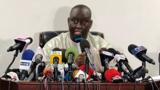 Aliou Sall speaks during a news conference