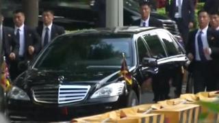Screenshot of Kim Jong-un's bodyguards running beside his car