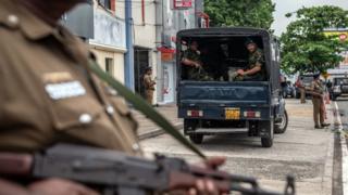 Soldiers and armed police guard the area near Dawatagaha Jumma Masjid ahead of Friday prayers on April 26, 2019 in Colombo, Sri Lanka