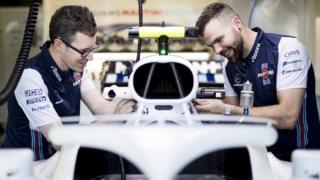 Jack and Chris working on Lance Stroll's F1 car