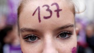 A protester with the number 137 on her forehead in Paris. Photo: 23 November 2019