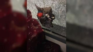 Shattered glass was left on seats on the bus
