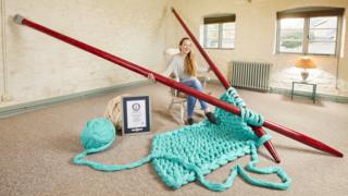 Betsy Bond, with the largest knitting needles.