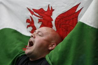 A Cardiff City fan singing and enjoying the day with his Welsh dragon flag during the 2008 FA Cup Final between Portsmouth and Cardiff City at Wembley Stadium in London, England, UK. (Photo by ben radford/Corbis via Getty Images)