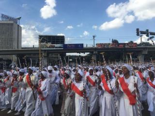 Ethiopians in white robes take part in the celebrations