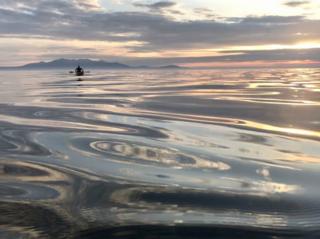 Canoe off Ardrossan. Arran in the background.