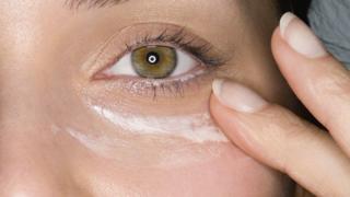 woman applying moisturiser