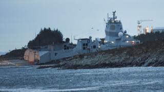 Norwegian frigate KNM Helge Ingstad takes the water after a collision with tanker Sola TS in the waters off Oygarden, Norway, 8 November 2018