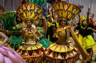 Performers from "Cape Town Carnival" of South Africa take part in the annual Lunar New Year parade in the Kowloon district of Hong Kong on February 5, 2019, to mark the Year of the Pig.