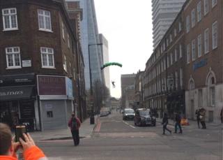 Base jumper landing on street