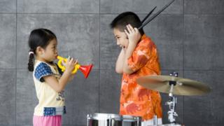 Stock photo of children playing music
