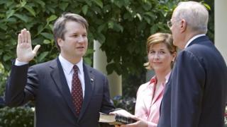 Brett Kavanaugh is sworn in by Justice Anthony Kennedy