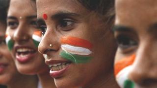 Women from the Vandemataram social organisation paint themselves in the tricolor flag of India for Independence Day in 2016.