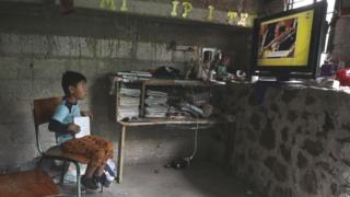 Oscar Hernandez, 5, follows a televised class at home as millions of students returned to classes virtually after schools were ordered into lockdown in March, due to the coronavirus disease (COVID-19) outbreak, in Chilcuautla, Hildalgo state, Mexico August 24, 2020.