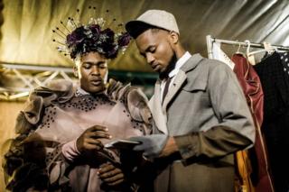 Male models prepare backstage during the fashion preview and concert show for the pre-Durban July Handicap horse race on June 30, 2018 in Durban