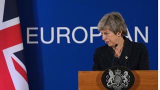 Theresa May at podium