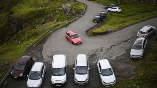 Tourists’ cars parked at the Quiraing