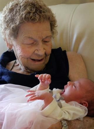 Vera Sommerfeld, 96, of Lethbridge, Canada, is pictured holding her baby great-great-great-grandaughter, Callie Marsh