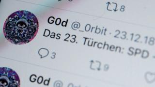 A photograph of a screen shows tweets by twitter user @_0rbit in German, mentioning the SPD political party