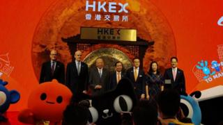 Alibaba chairman Daniel Zhang in the centre of a picture of Alibaba executives adn Chinese officials at the Hong Kong stock exchange