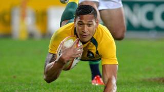 Israel Folau scores a try while playing for the Wallabies during a test match in 2017