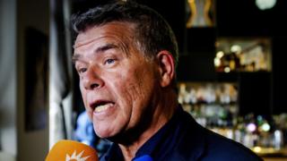 Emile Ratelband, 69, speaks with the press in a bar in Amsterdam