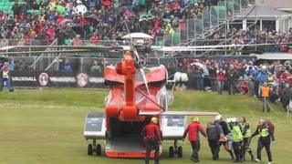 An air ambulance transfers an injured woman to hospital during the 2015 North West 200.