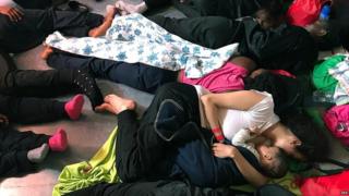 A handout photo made available by NGO "SOS Mediterranee" shows migrants resting on the ship Aquarius, in the Mediterranean Sea, 14 June 2018