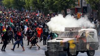 in_pictures Demonstrators clash with security forces during a protest against Chile's government in Valparaiso on 12 November, 2019.