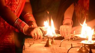 Indian Hindu devotees offering prayers on the first day of the Hindu festival of Chaitra Navratri at Ram Ghat near Sangam