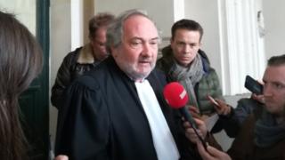 Belgian lawyer Vincent Lurquin speaks to reporters