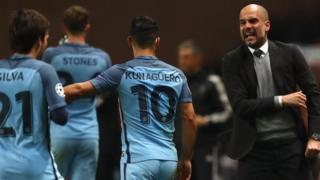 Pep Guardiola gives instructions to his players