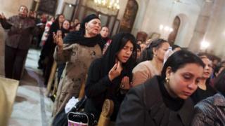 Coptic Orthodox Christian pray during a religious session by father Makary at St Mark Cathedral in Cairo December 26, 2014