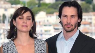 Carrie-Anne Moss ve Keanu Reeves