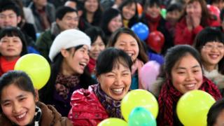 In this picture taken on January 15, 2011, workers gather for a Chinese new year dinner provided by their employer