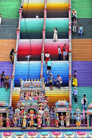 in_pictures Tourist walks on the steps at a Hindu temple